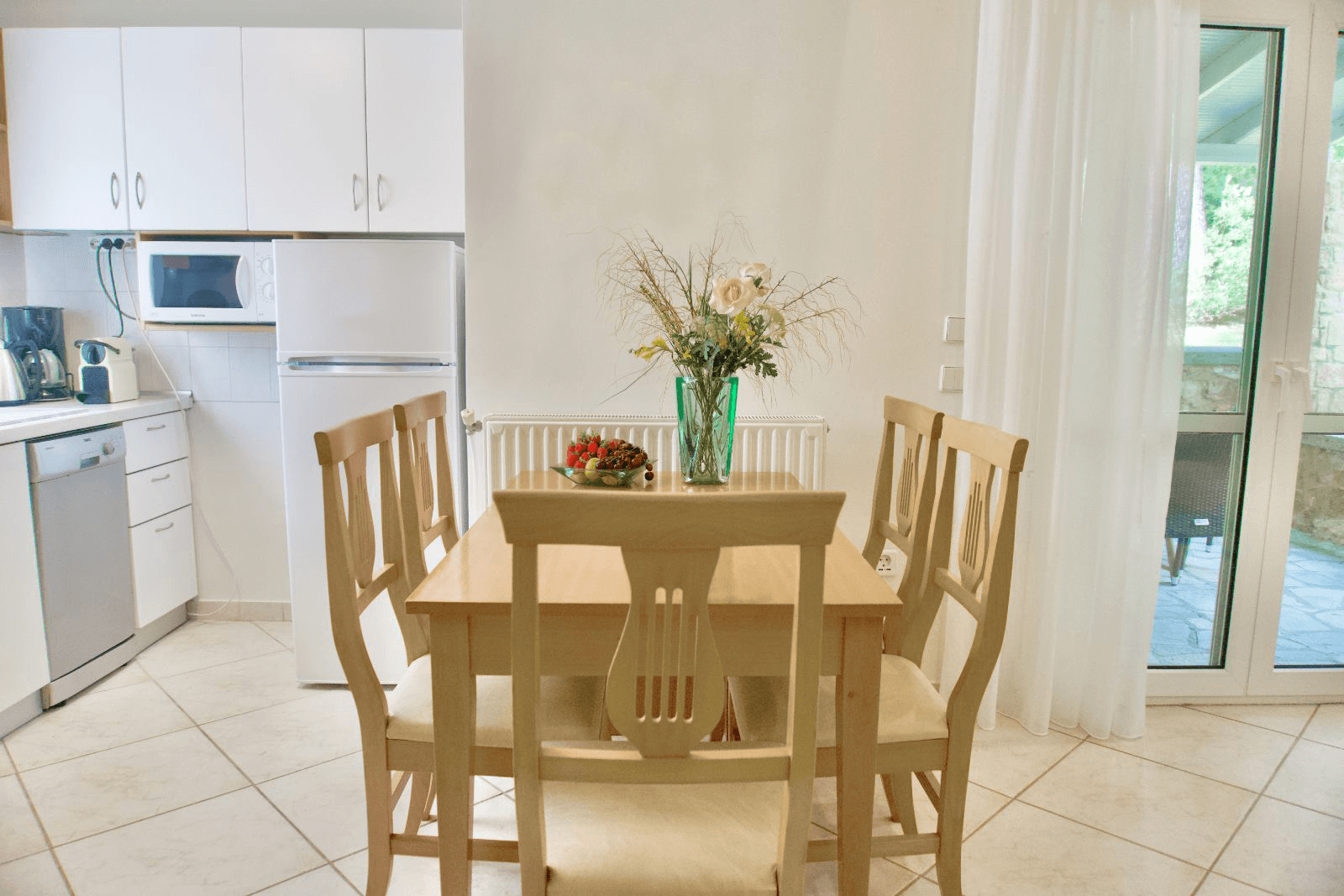 Sani Cape Villas for sale Dining table and kitchen